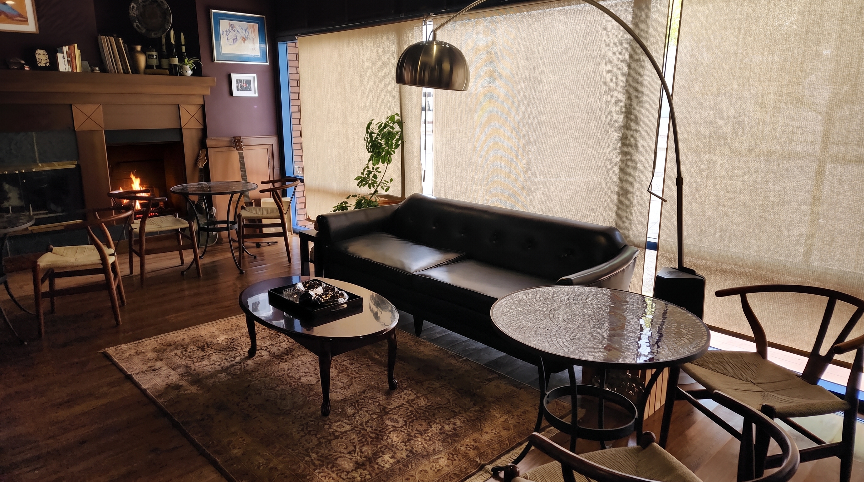 Lounge seating by the fireplace in the new space next to Kalimera
