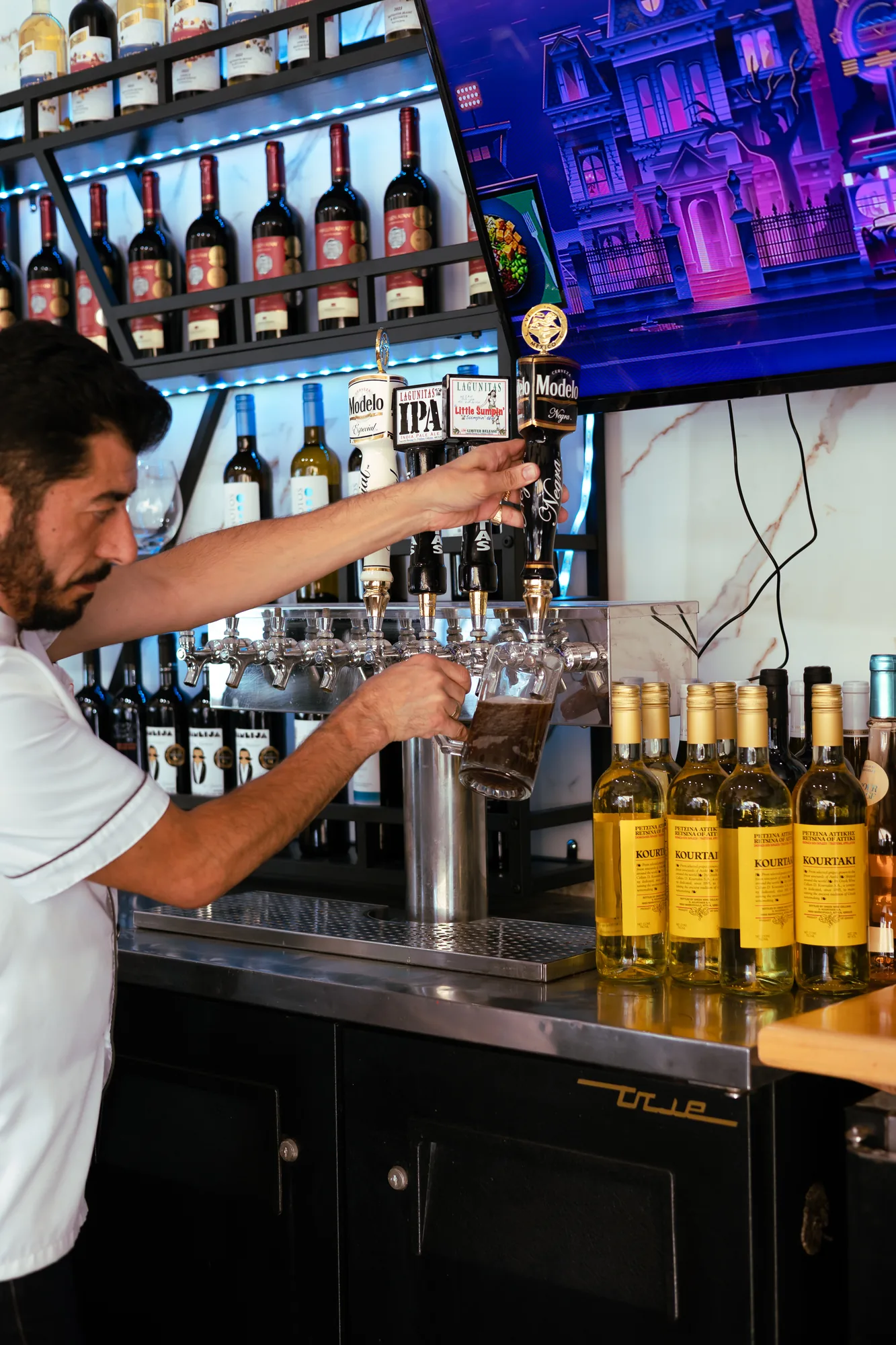 Wine and beer taps at the bar at Kalimera Bar & Grill